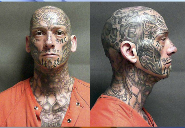 Authorities searching for heavily tattooed escaped inmate