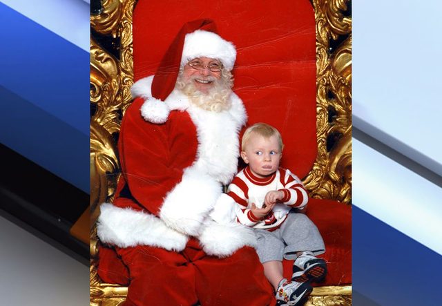 Boy signals 'help' in sign language after being placed on Santa's lap
