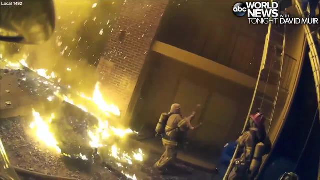 As apartment burns, video shows Georgia firefighter catching child 'like a football'